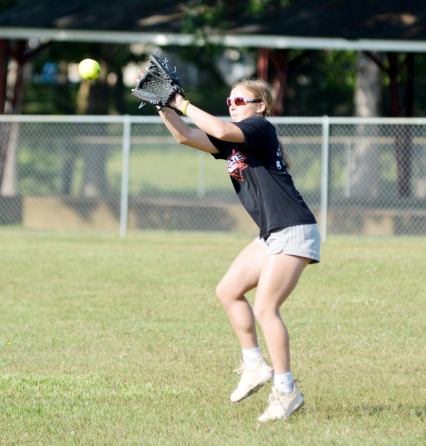 Aubrey Rehmert catches a ball before throwing it on to a teammate during Belle High School’s annual softball camp held back in June.